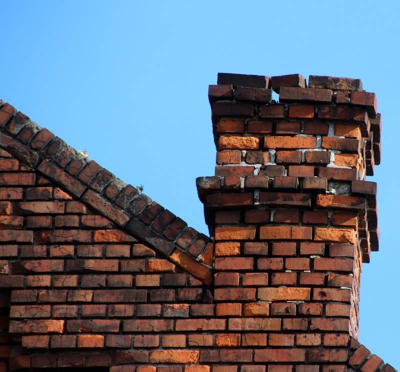 Signs Your Ida Home Needs a Chimney Inspection Damaged chimney on an Ida home showing cracks and missing mortar